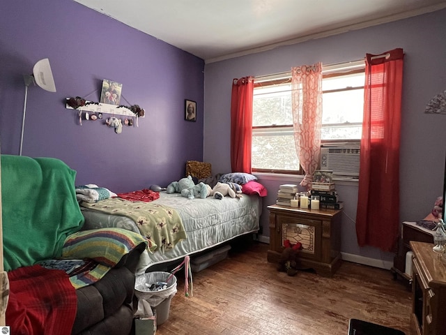 bedroom featuring cooling unit and wood-type flooring