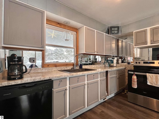 kitchen with sink, dishwasher, stainless steel range with electric stovetop, dark hardwood / wood-style flooring, and decorative light fixtures