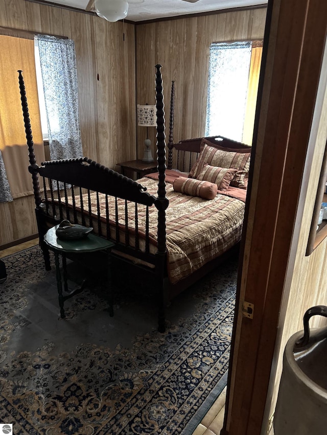 bedroom with wood walls