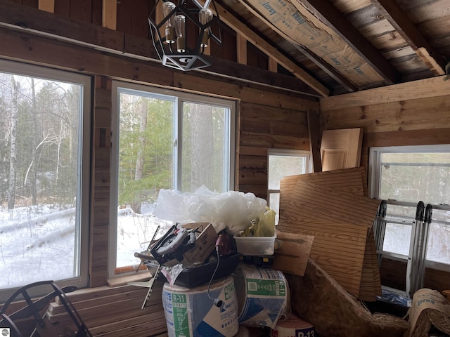 interior space with lofted ceiling with beams and wooden ceiling