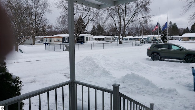 view of yard layered in snow