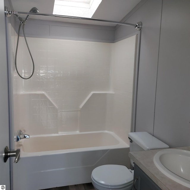 full bathroom featuring vanity, bathing tub / shower combination, and toilet