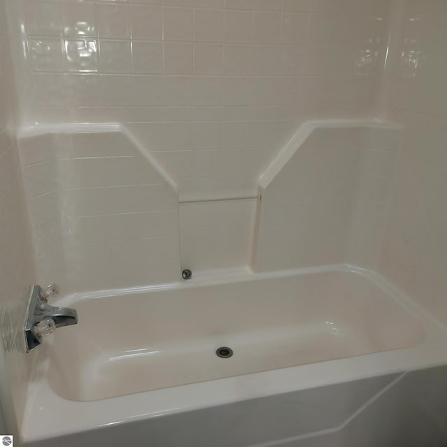 bathroom featuring a tub to relax in