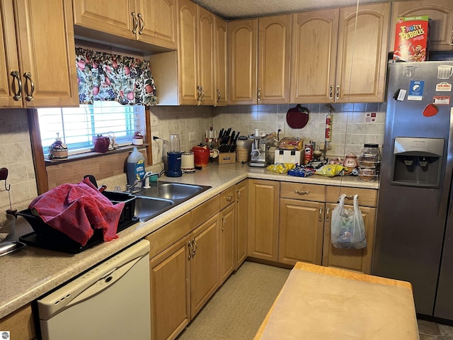 kitchen featuring sink, dishwasher, stainless steel fridge with ice dispenser, and backsplash