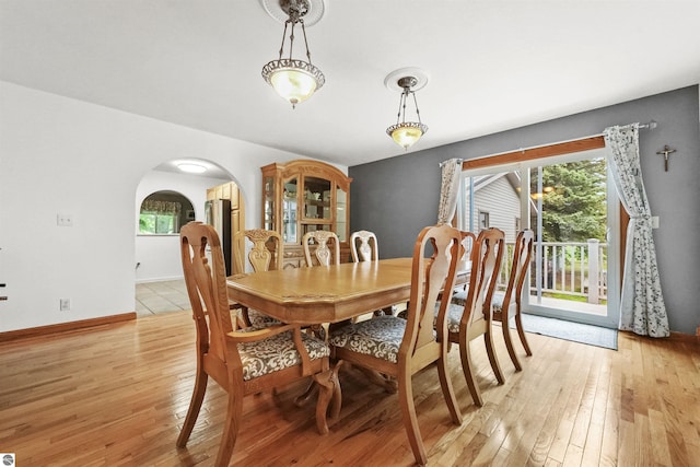 dining space featuring light wood-type flooring