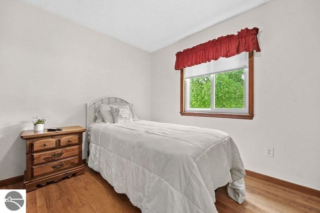 bedroom featuring hardwood / wood-style floors