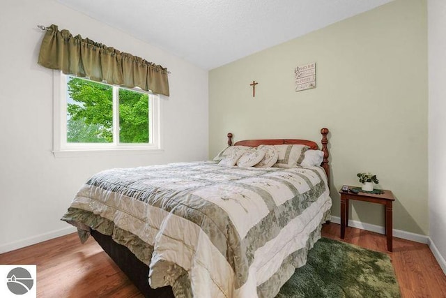 bedroom featuring hardwood / wood-style floors