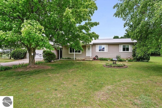 ranch-style home featuring a garage and a front lawn