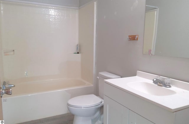 full bathroom with vanity,  shower combination, and toilet