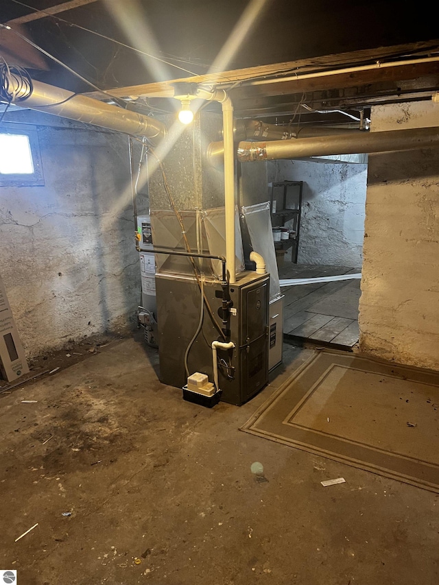 basement featuring heating unit