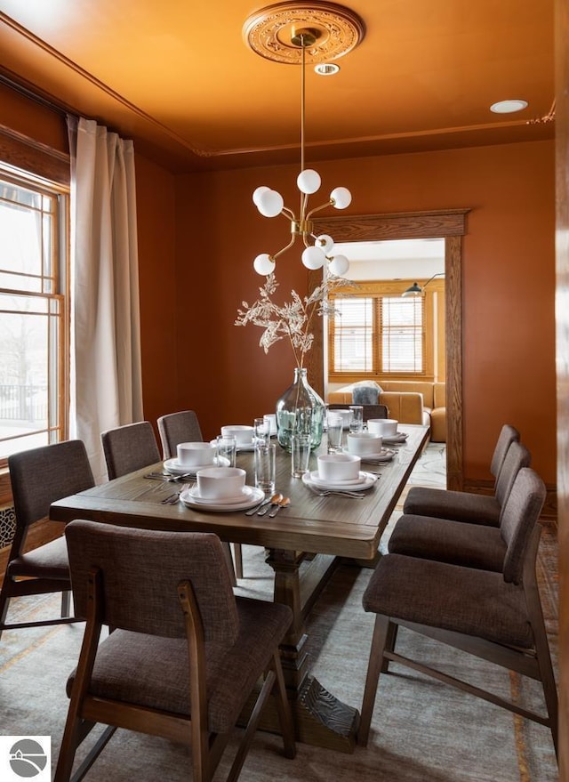 dining space featuring an inviting chandelier