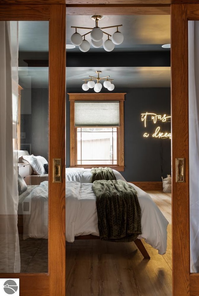 bedroom with hardwood / wood-style floors