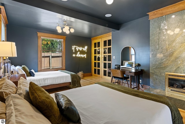 bedroom with wood-type flooring and heating unit