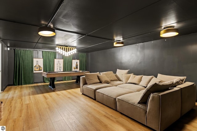 cinema featuring pool table and light wood-type flooring