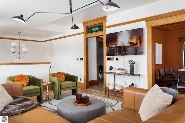 living room with hardwood / wood-style floors and a notable chandelier