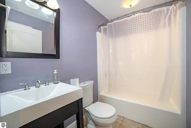 full bathroom with shower / tub combo with curtain, tile patterned flooring, vanity, vaulted ceiling, and toilet