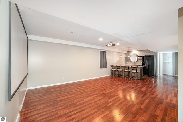 unfurnished living room with dark hardwood / wood-style floors