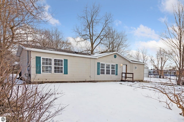 view of snow covered house