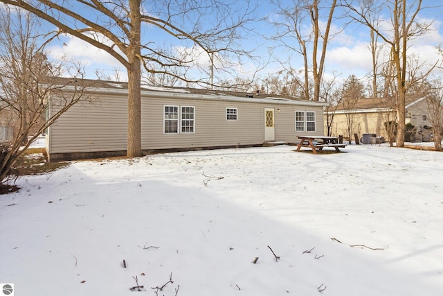 view of snow covered house