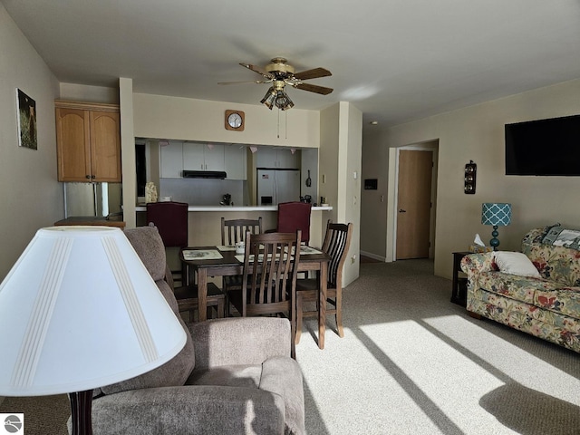 living room featuring ceiling fan and light colored carpet