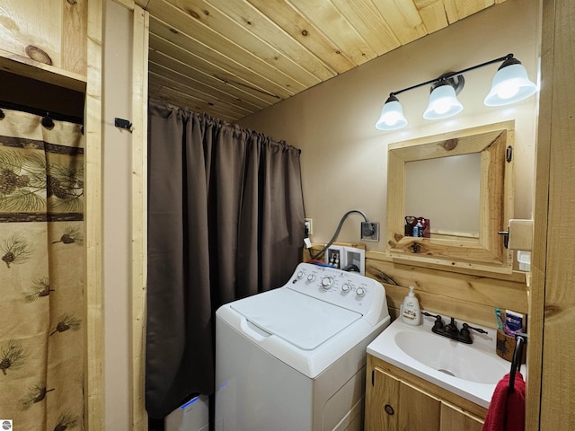 washroom with washer / dryer, sink, and wooden ceiling