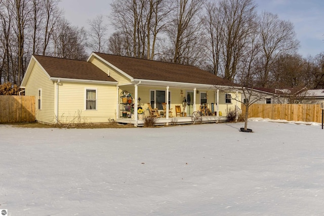 rear view of house featuring a porch