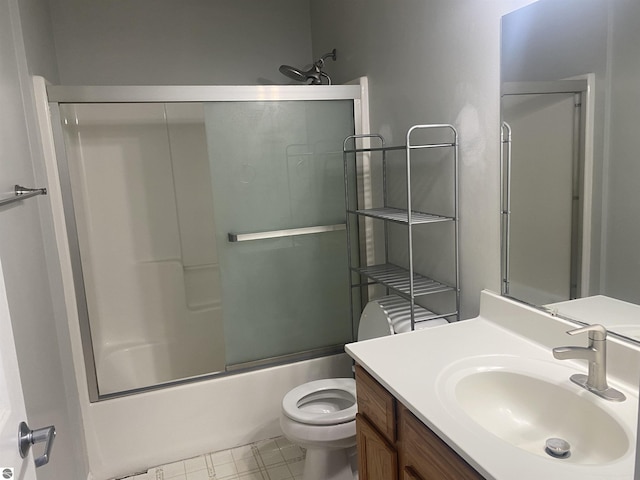 full bathroom with vanity, shower / bath combination with glass door, and toilet