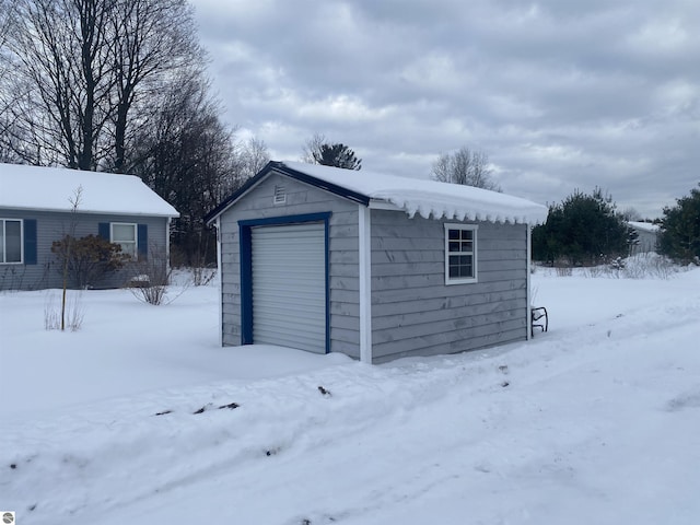 view of snow covered garage