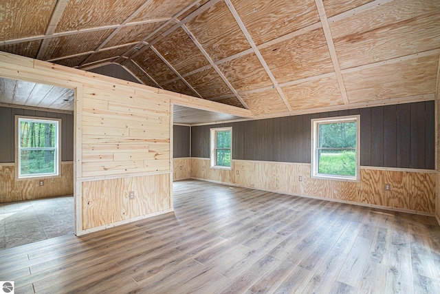 spare room with hardwood / wood-style flooring, a wealth of natural light, and wooden ceiling