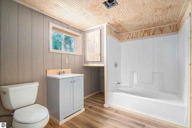 full bathroom featuring toilet, wood walls, wood-type flooring, wooden ceiling, and shower / tub combination