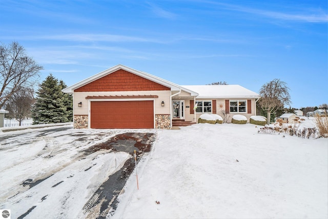 view of front of home with an attached garage and stone siding