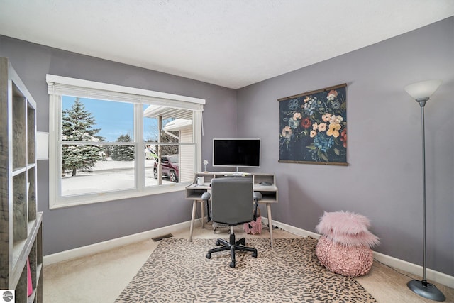 home office featuring visible vents, carpet, and baseboards