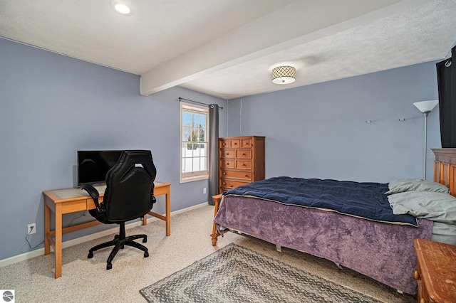 bedroom featuring beam ceiling, light carpet, and baseboards