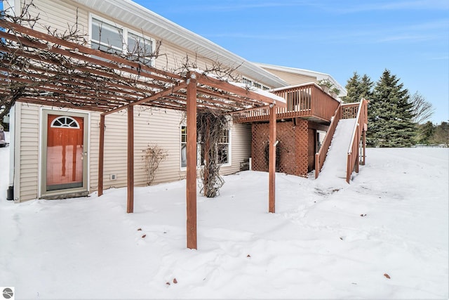 exterior space with a wooden deck and stairs