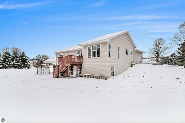 exterior space featuring stairs and a deck