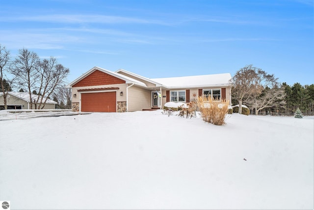 view of front of home with stone siding and an attached garage