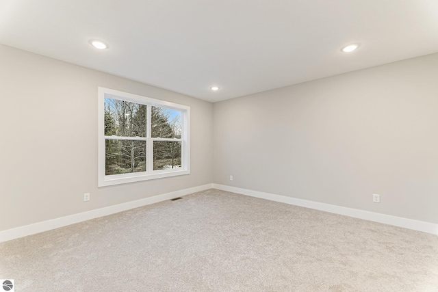 unfurnished room featuring carpet