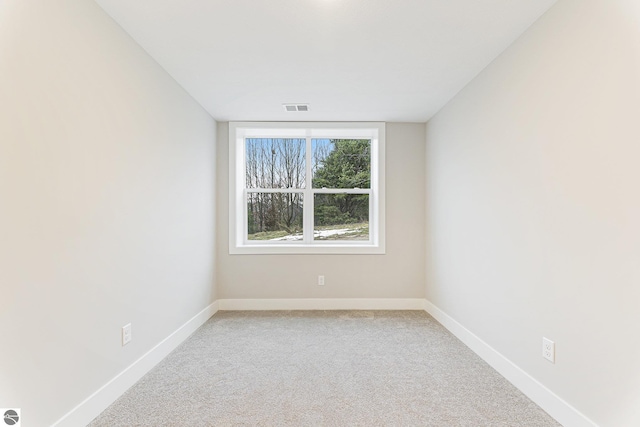 unfurnished room featuring carpet