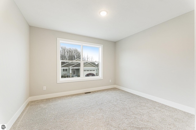 unfurnished room featuring carpet flooring