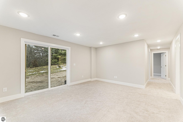 empty room featuring light colored carpet