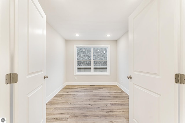 unfurnished room with light hardwood / wood-style floors