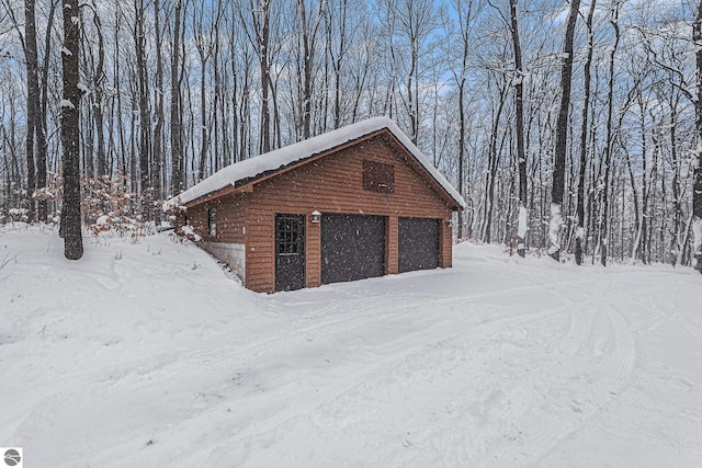 view of snow covered garage