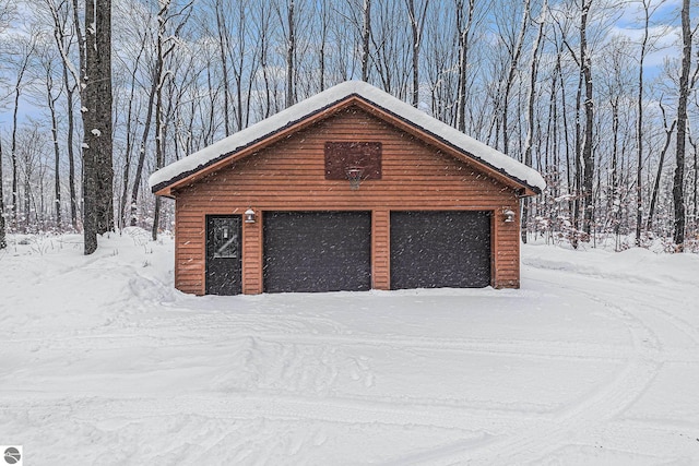 view of snow covered garage