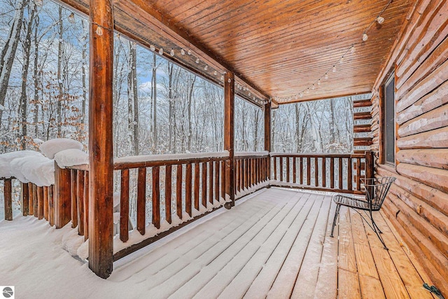 view of snow covered deck