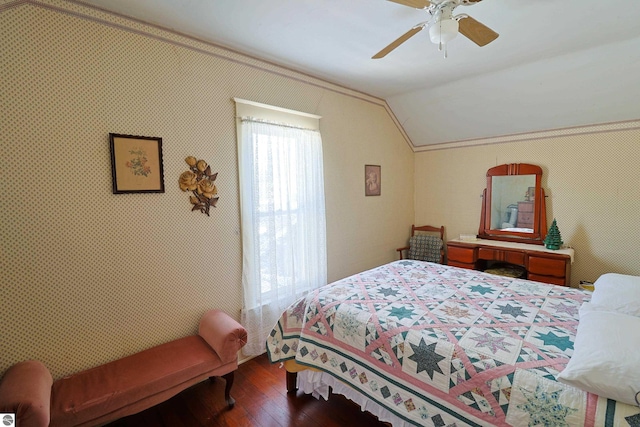 bedroom with ceiling fan, wood-type flooring, and lofted ceiling