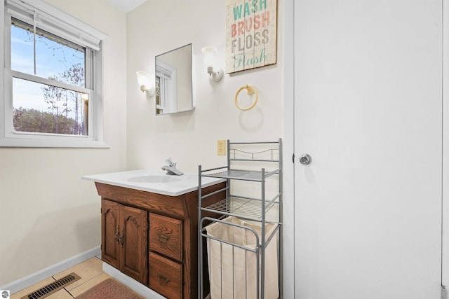 bathroom featuring tile patterned floors and vanity