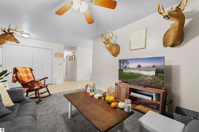 tiled living room with ceiling fan