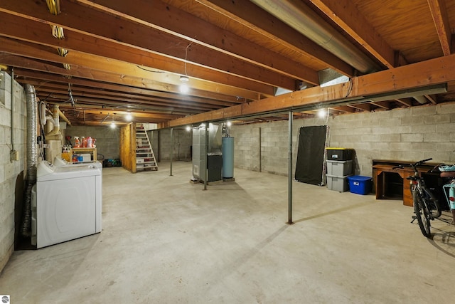 basement featuring heating unit, washer / dryer, and gas water heater