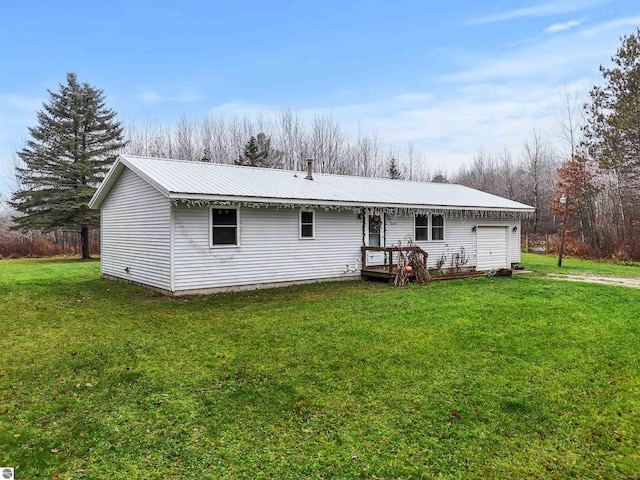 back of property featuring a lawn