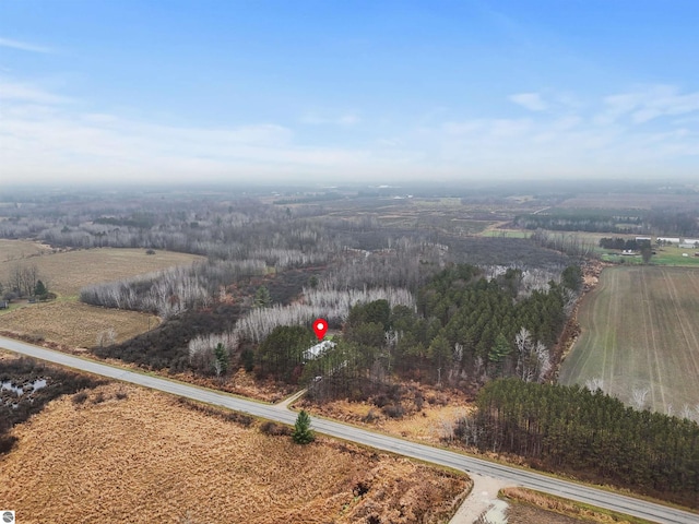 birds eye view of property featuring a rural view